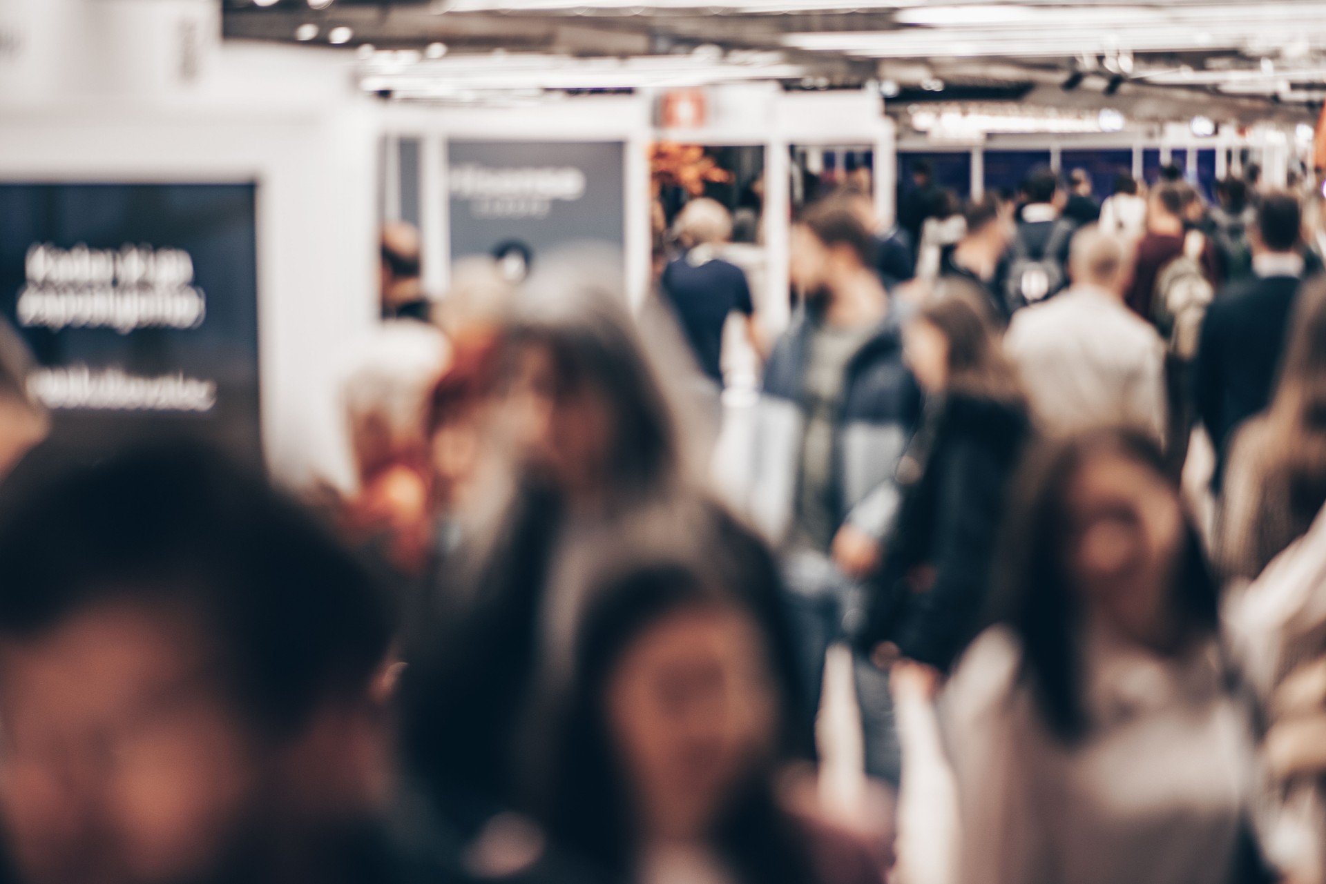 Abstract blurred people at exhibition hall of expo event trade show. Business convention show or job fair. Business concept background.