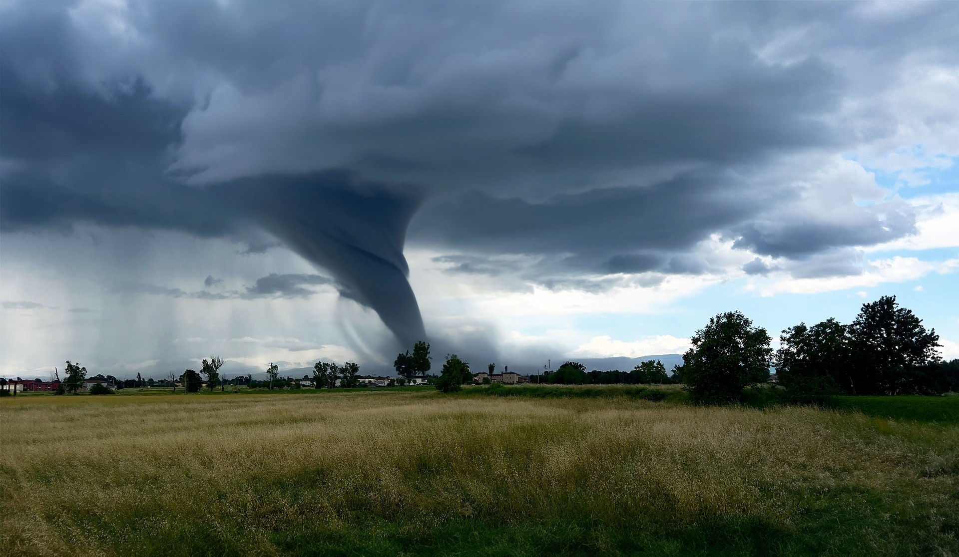 Tornado over cultivated fields