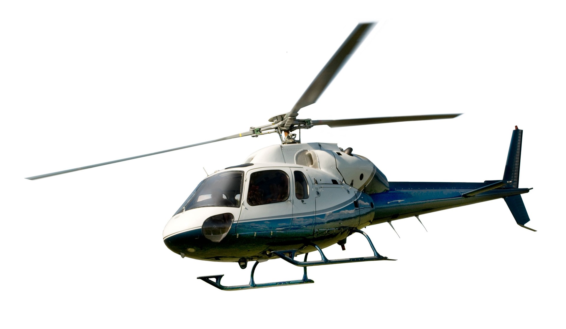 Helicopter in flight isolated against white